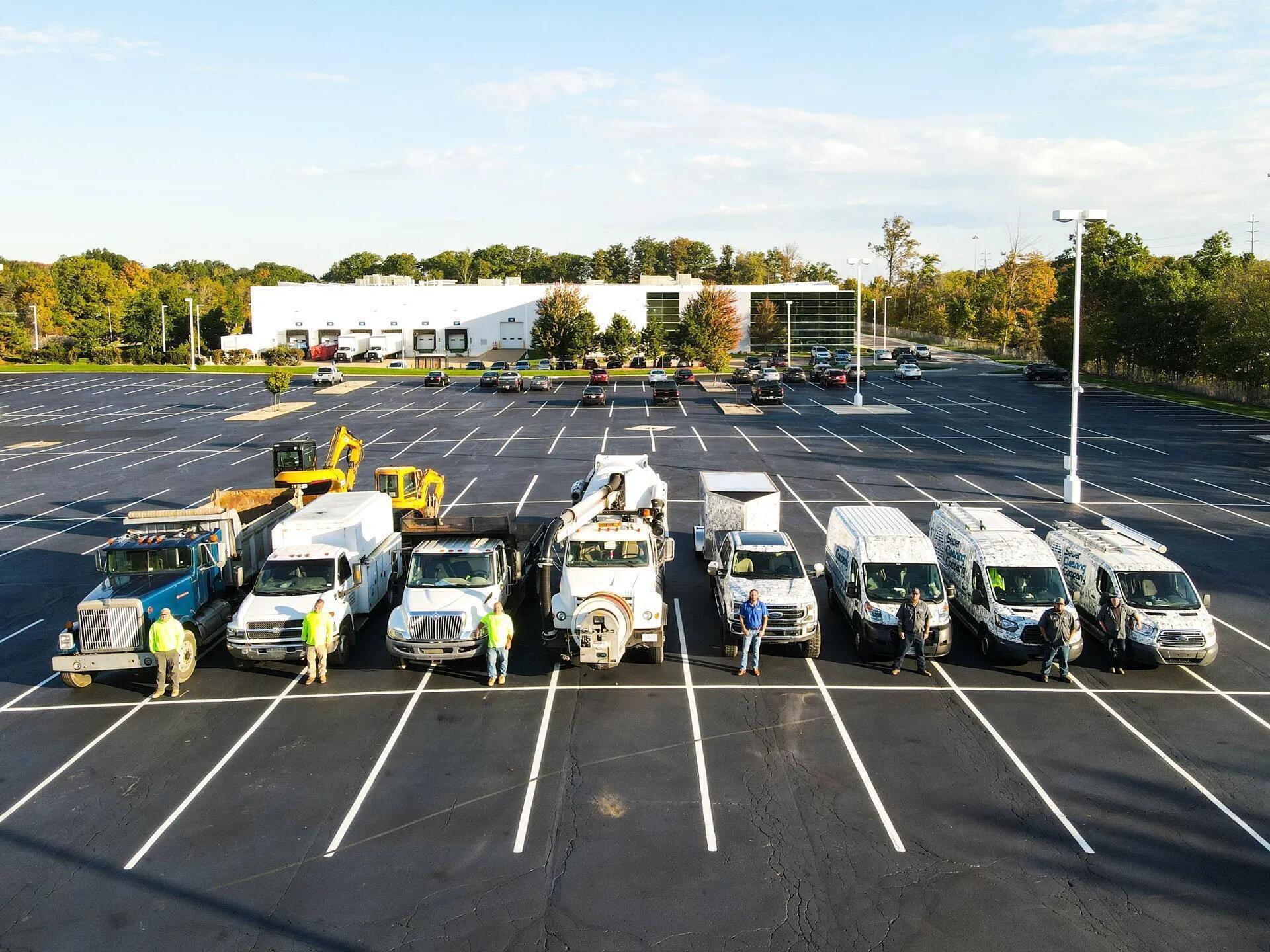 Sewer Cleaning Company fleet of service vehicles and team